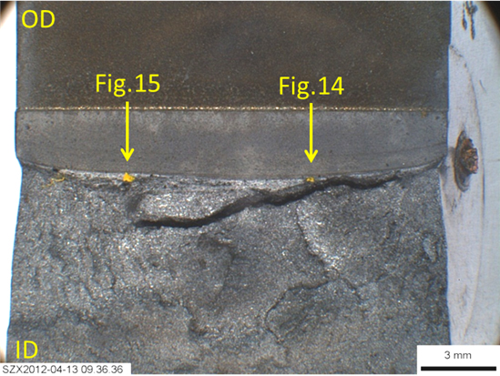 Figure 9. Fracture surface of sample W01-50, showing two yellow dots (indicated by arrows), for the potential pop-in initiation sites. Arrows also give the planes of sectioning. Note the split beneath the test fracture